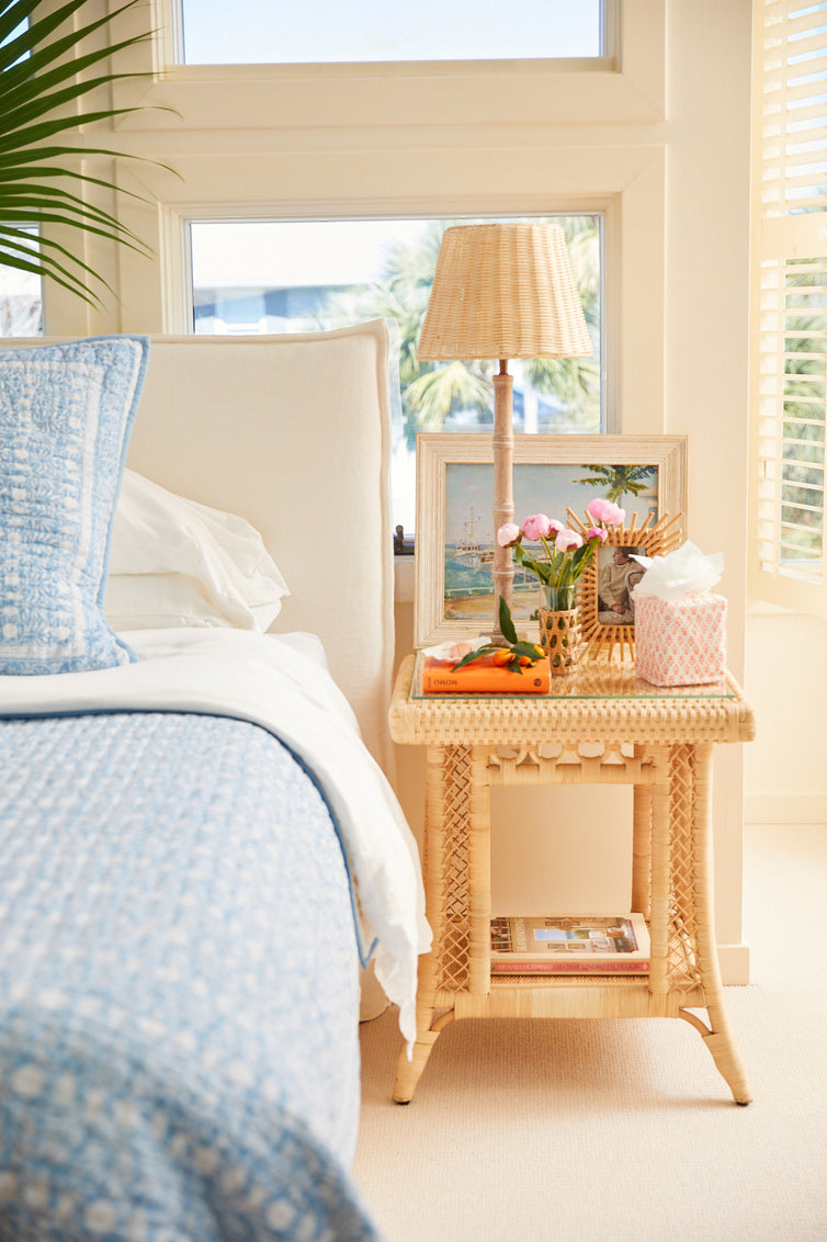 Hope Town Side Table by Amanda Lindroth bedroom lifestyle image. Natural rattan adds a light look.