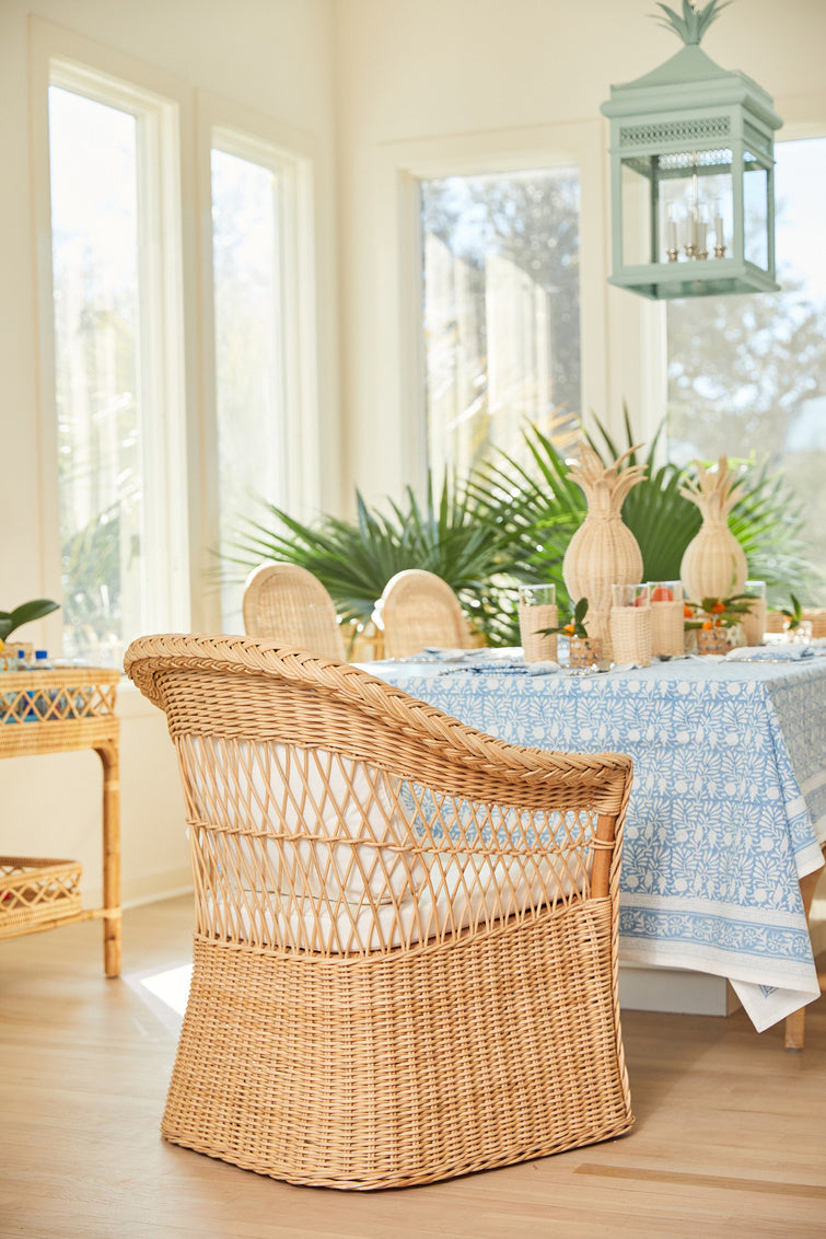 Worth Chair by Amanda Lindroth rattan chair ideal for spacious spaces shown in dining setting