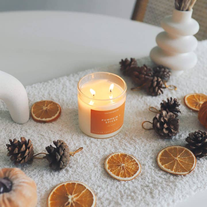 Pumpkin + Spices clear glass tumbler candle has a 37 hour estimated burn-life