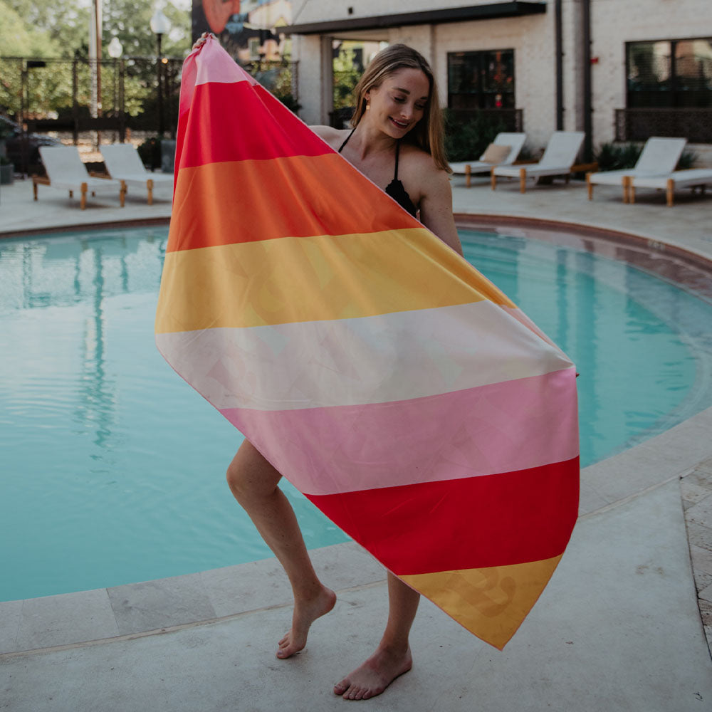 Live Happy Quick Dry Beach Towel with colorful stripes on reverse side
