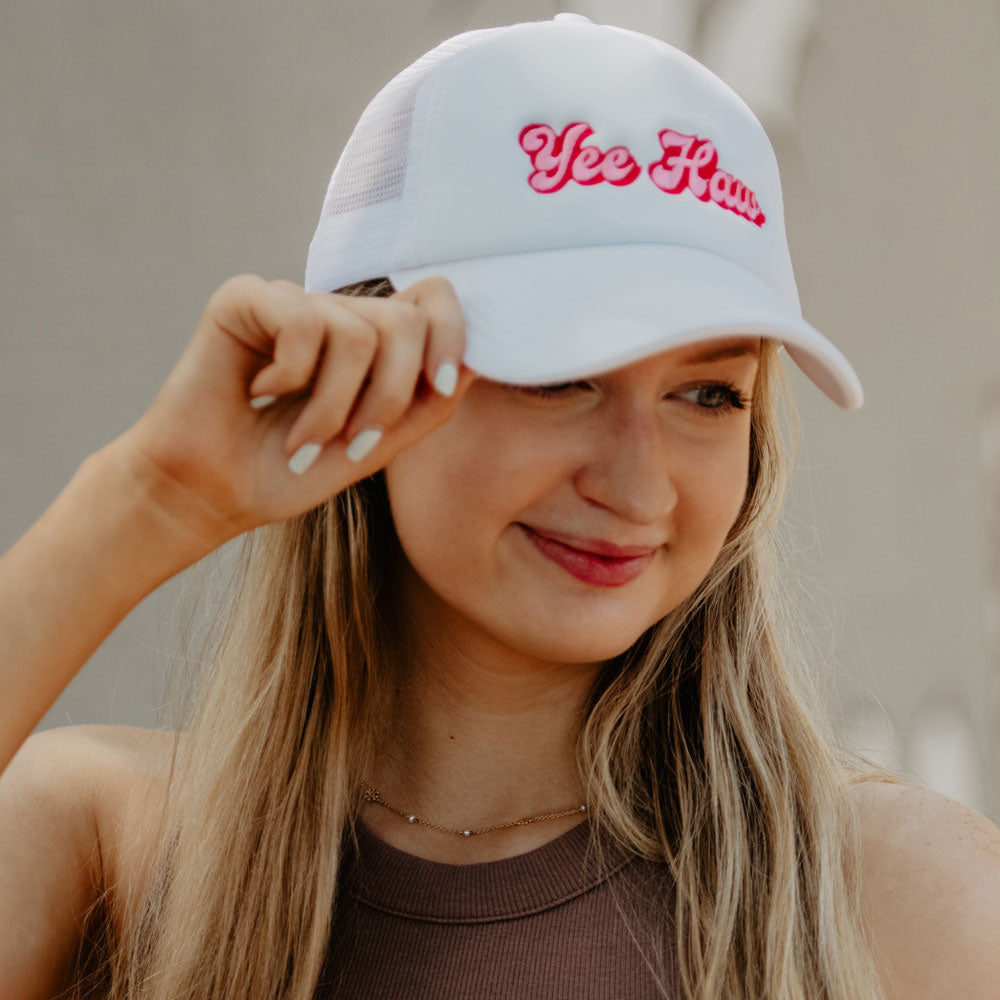 Yee Haw Foam Trucker Hat with pink script emboidered "Yee Haw" on white cap