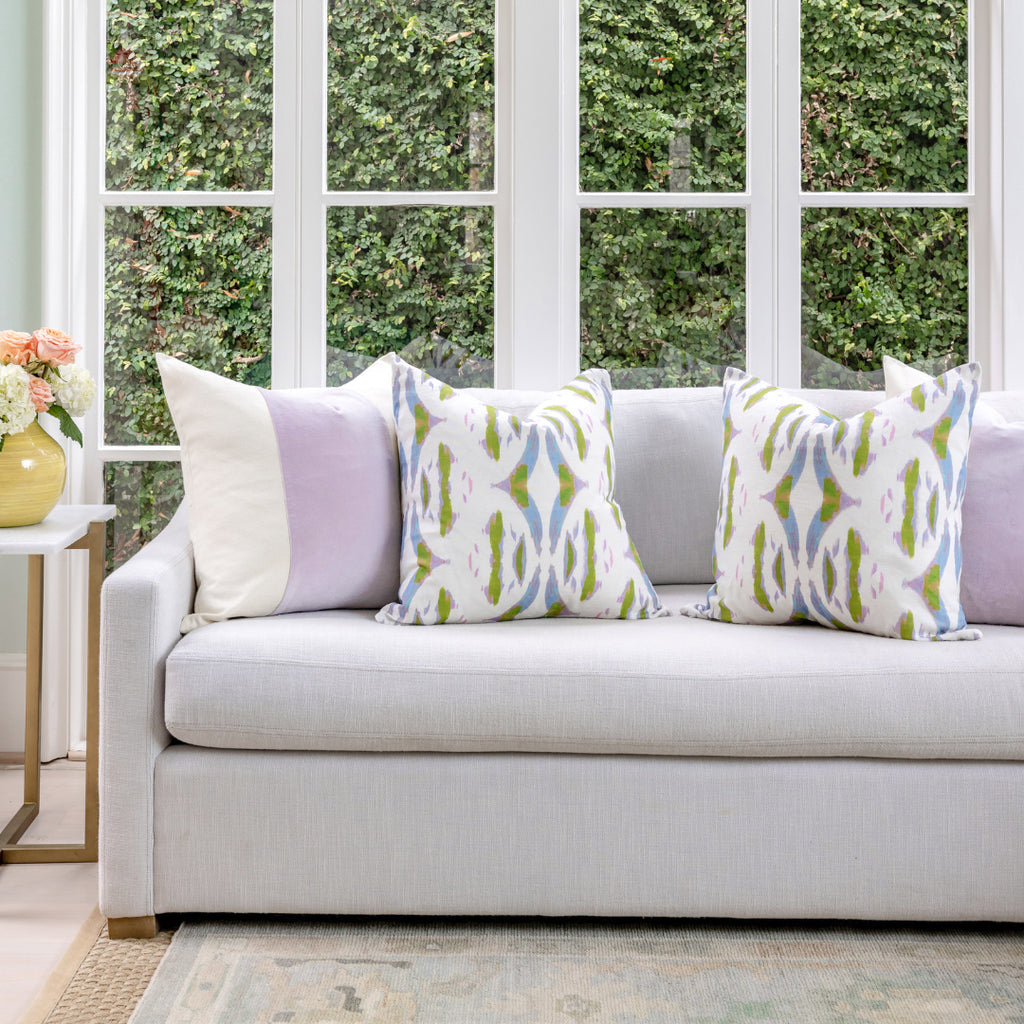 Tea Time Violet Throw Pillow in sofa display