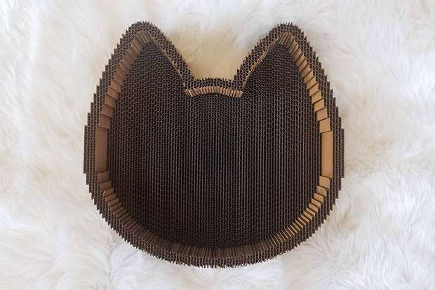 Cat Scratcher Bed has raised edges for scratching and leaning against during nap