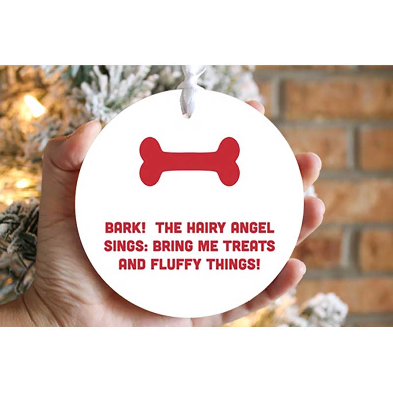 The Hairy Angel Sings Ornament close up in hand