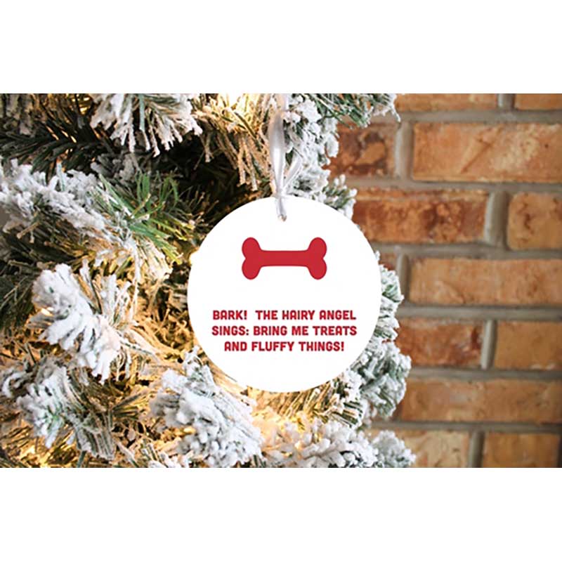 The Hairy Angel Sings Ornament on multi-colored flocked tree