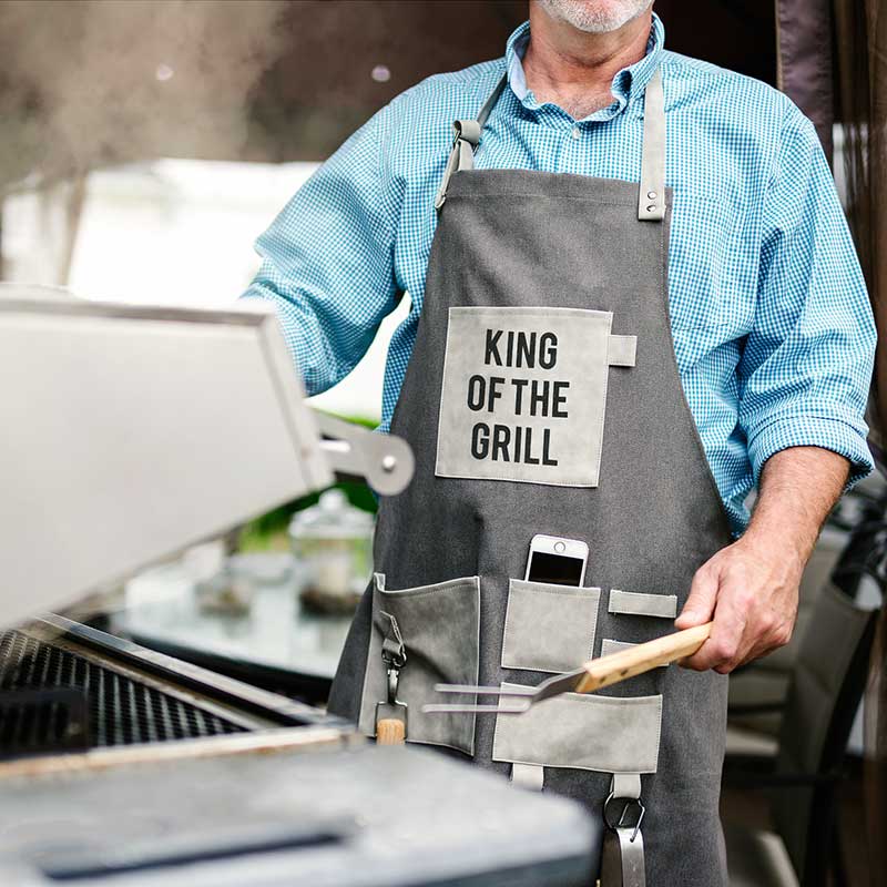 King of the Grill grilling apron 100% cotton canvas lifestyle view at grill