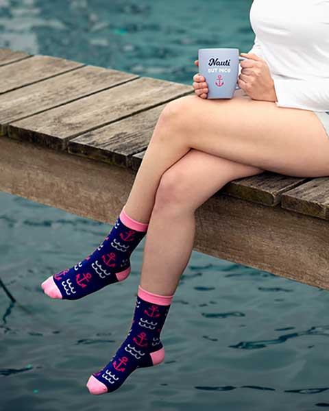 Nauti But Nice Cup in light blue matte finish with slogan woman on pier