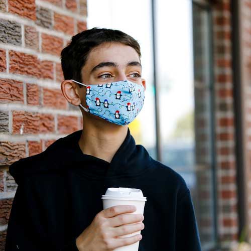 Penguins & Lights kid's mask with Penguins wearing caps stringing Christmas lights boy in mask