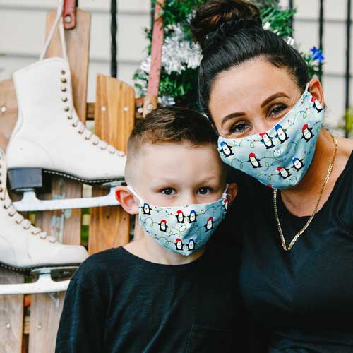 Penguins & Lights kid's mask with Penguins wearing caps stringing Christmas lights mother and son