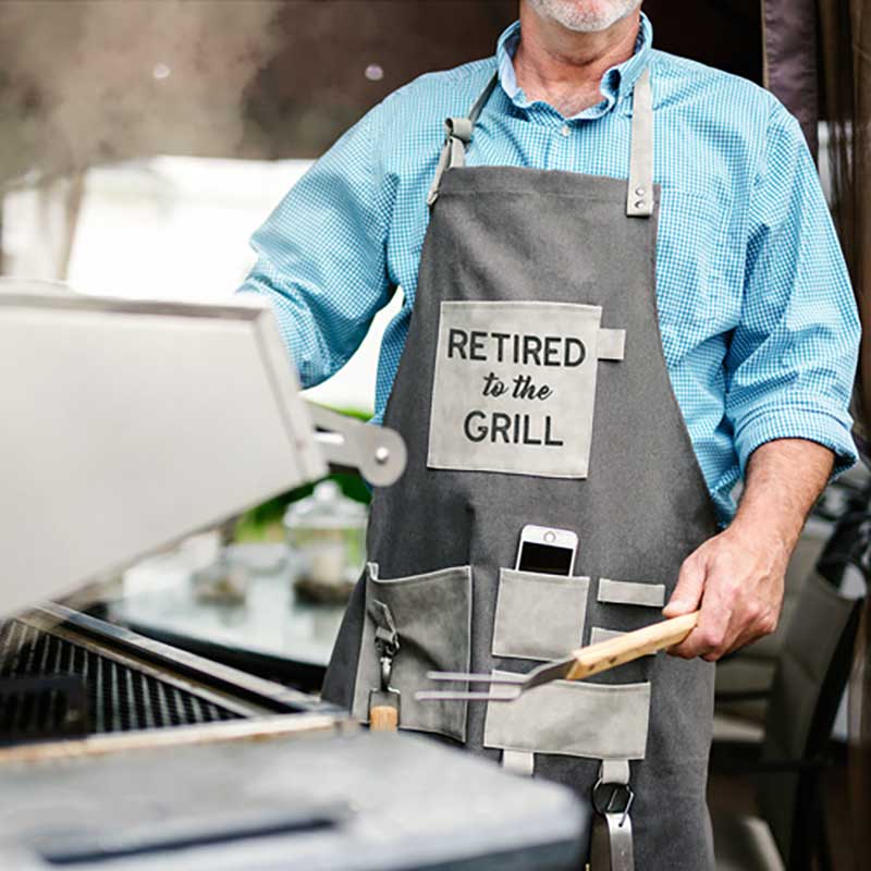 Retired To The Grill grillng apron showing man at grill