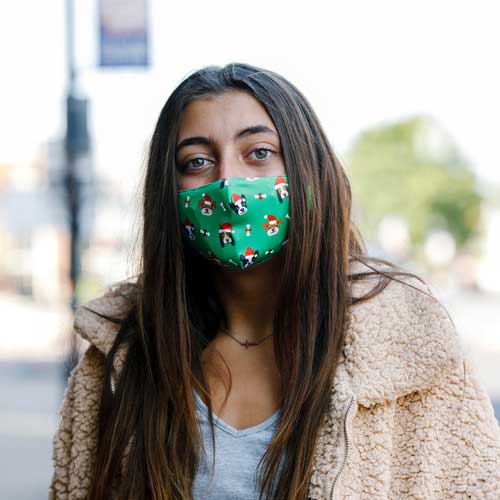 Santa Dog Kid's Mask with dogs in red caps and bones teenager wearing mask