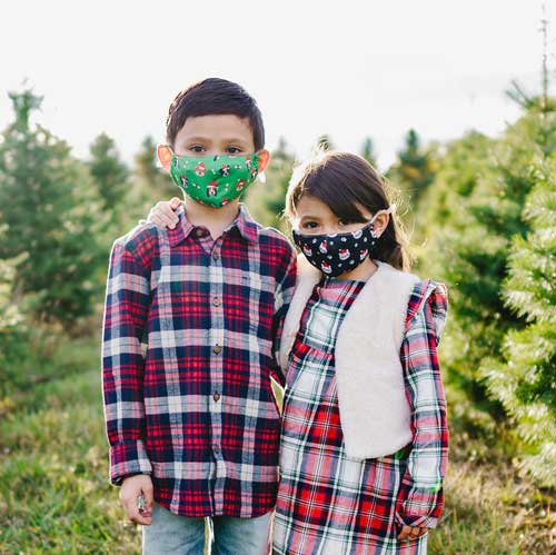 Santa Dog Kid's Mask with dogs in red caps and bones kid's wearing masks outdoor