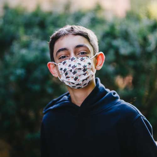 Snowman Kid's disposable face mask with snowman young boy wearing mask