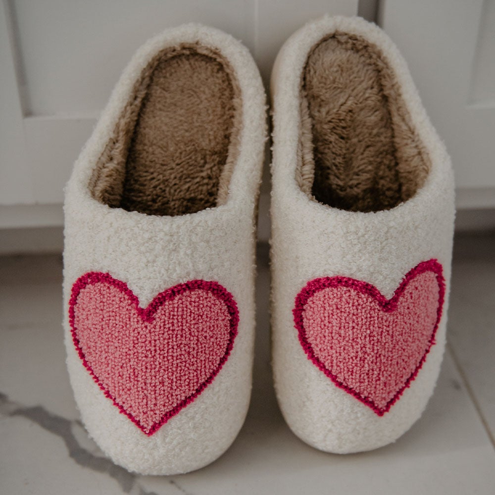 Pink & Red Heart Slippers from Katydid are a great Valentine’s gift. Pink hearts with red outline on white Sherpa, rubber soles