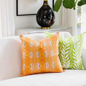 Orange Blossom Linen Throw Pillow in a sofa display