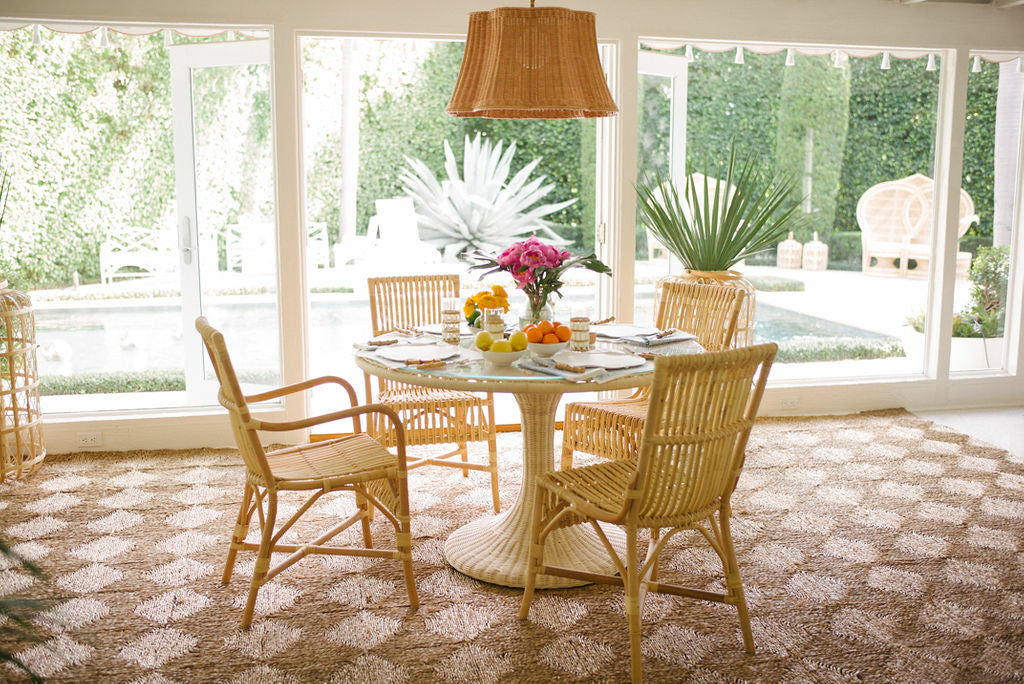 Biscayne Dining Table by Amanda Lindroth rattan table in sunroom dining setting
