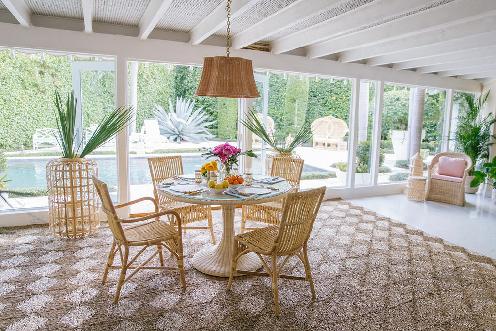 Biscayne Dining Table by Amanda Lindroth rattan dining table creates a tropical paradise feel