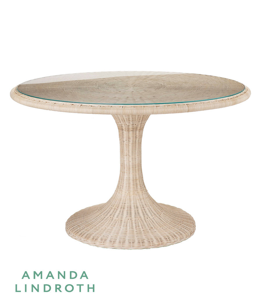Biscayne Dining Table by Amanda Lindroth rattan table with tulip base, glass top