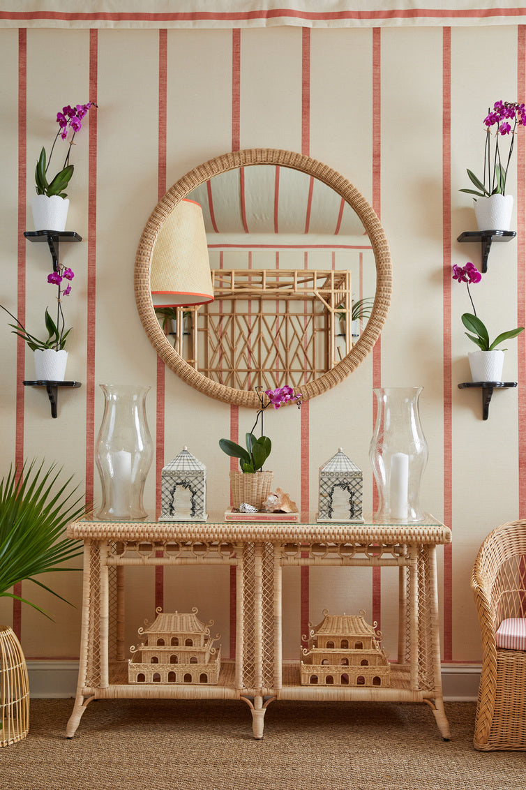 Dunmore Round Wicker Mirror by Amanda Lindroth accents a variety of decors