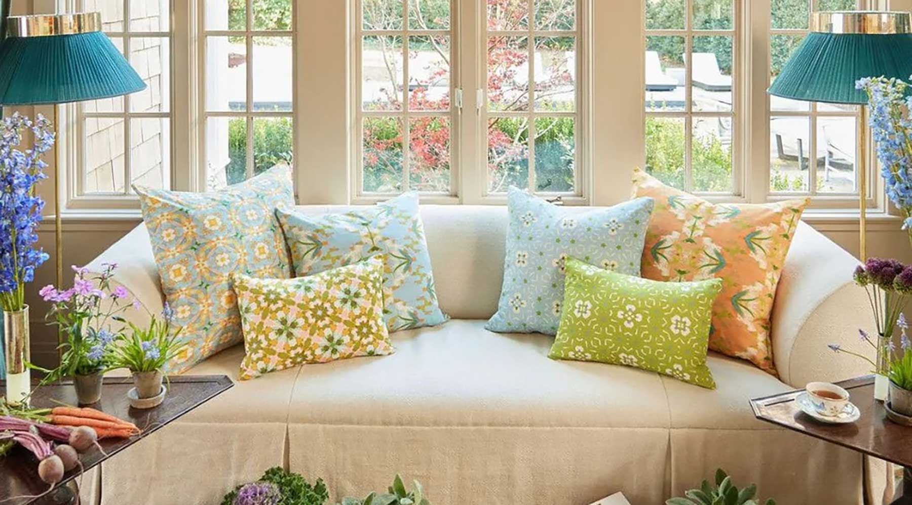 Sofa display of new throw pillows in the English Garden Collection from Laura Park Designs