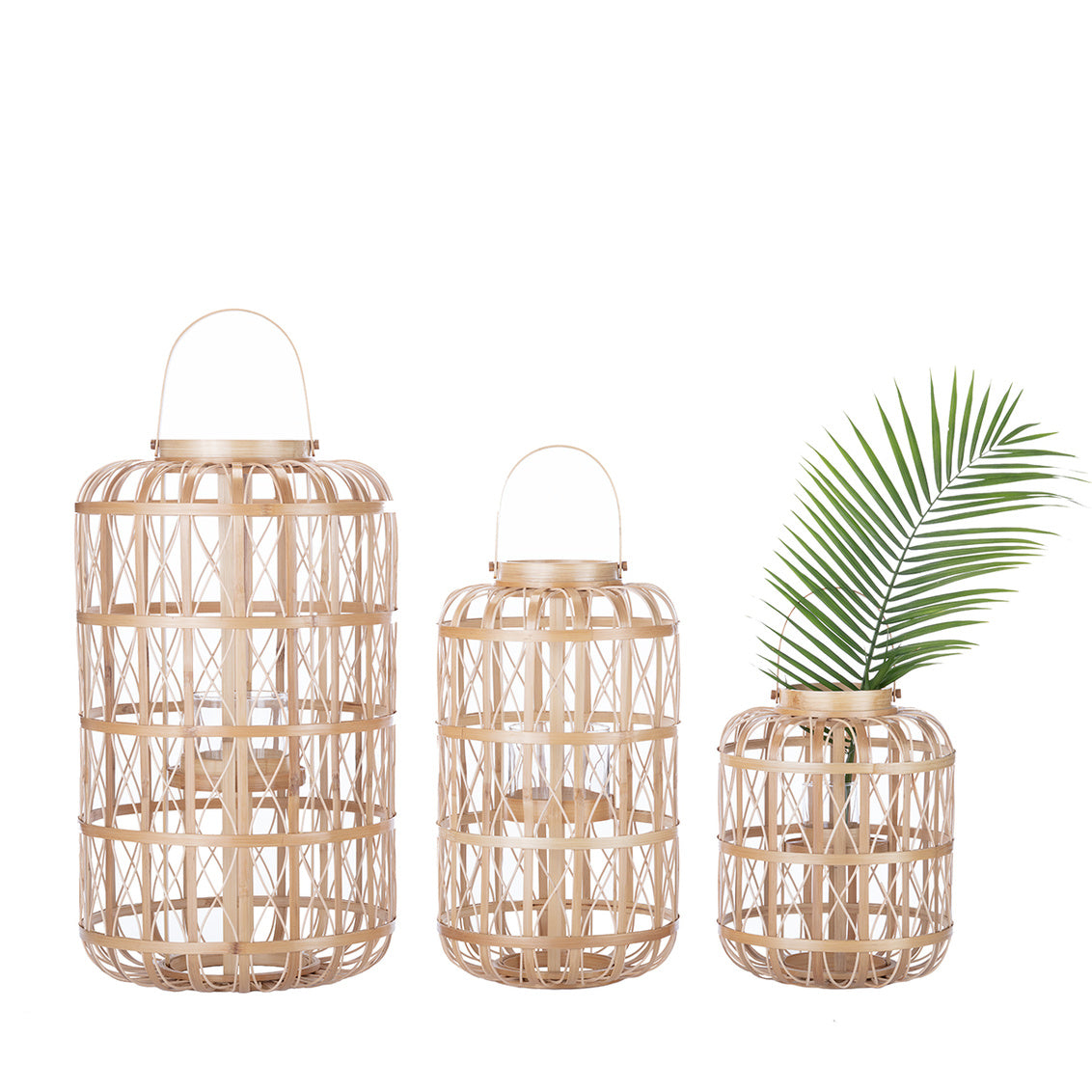 Harbour Island Lantern-Large shown with complementing sizes. Rattan, open-weave pattern.