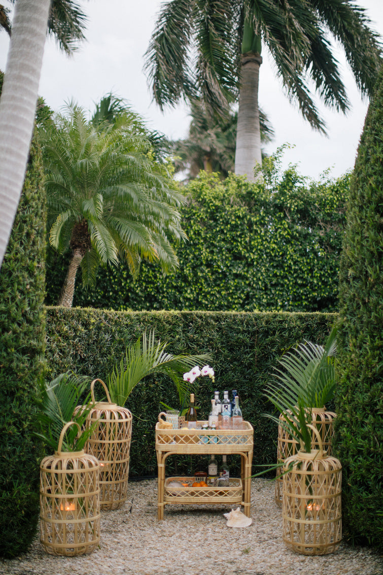 Harbour Island Lantern-Medium in outdoor setting with other sizes.