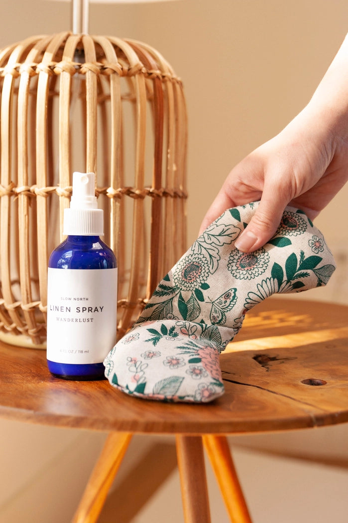 Hidden Falls Migraine Mask shown with a linen spray