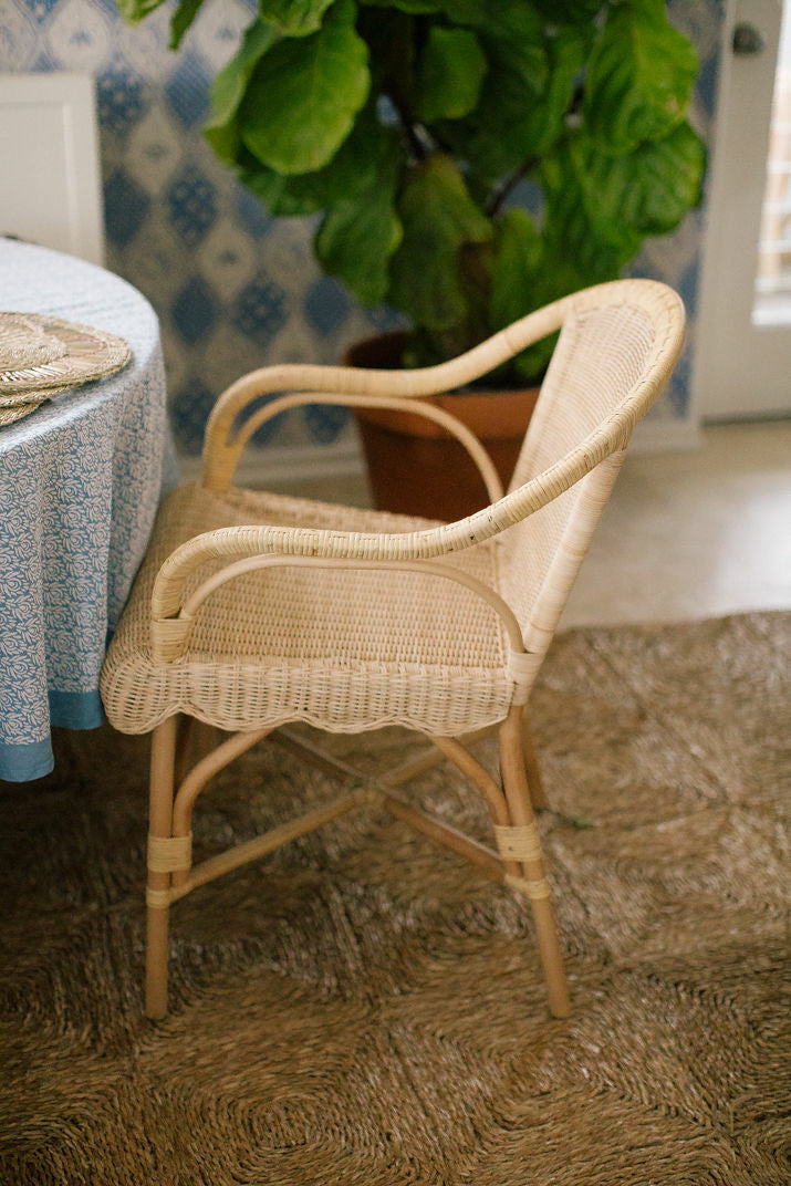 Hope Hill Chair by Amanda Lindroth rattan chair shown at table