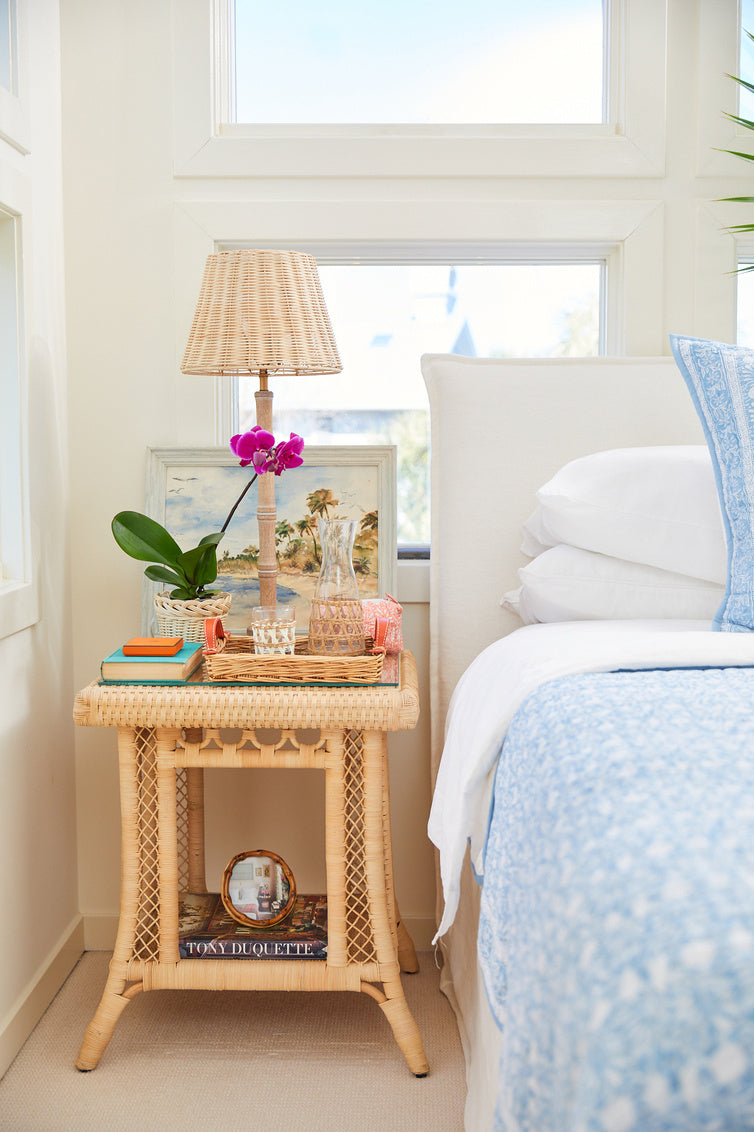 Hope Town Side Table by Amanda Lindroth bedroom lifestyle image. Natural rattan adds a light look.