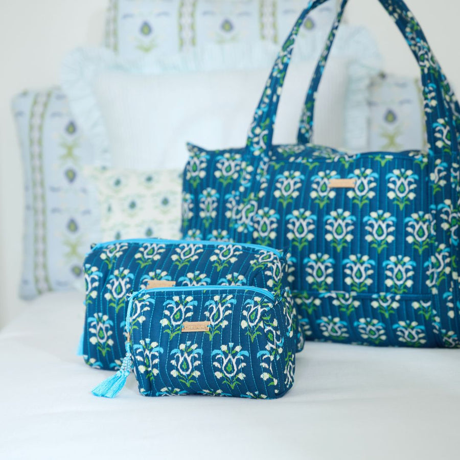 Rosemary Indigo Signature Small Cosmetic Bag shown with other bags in collection