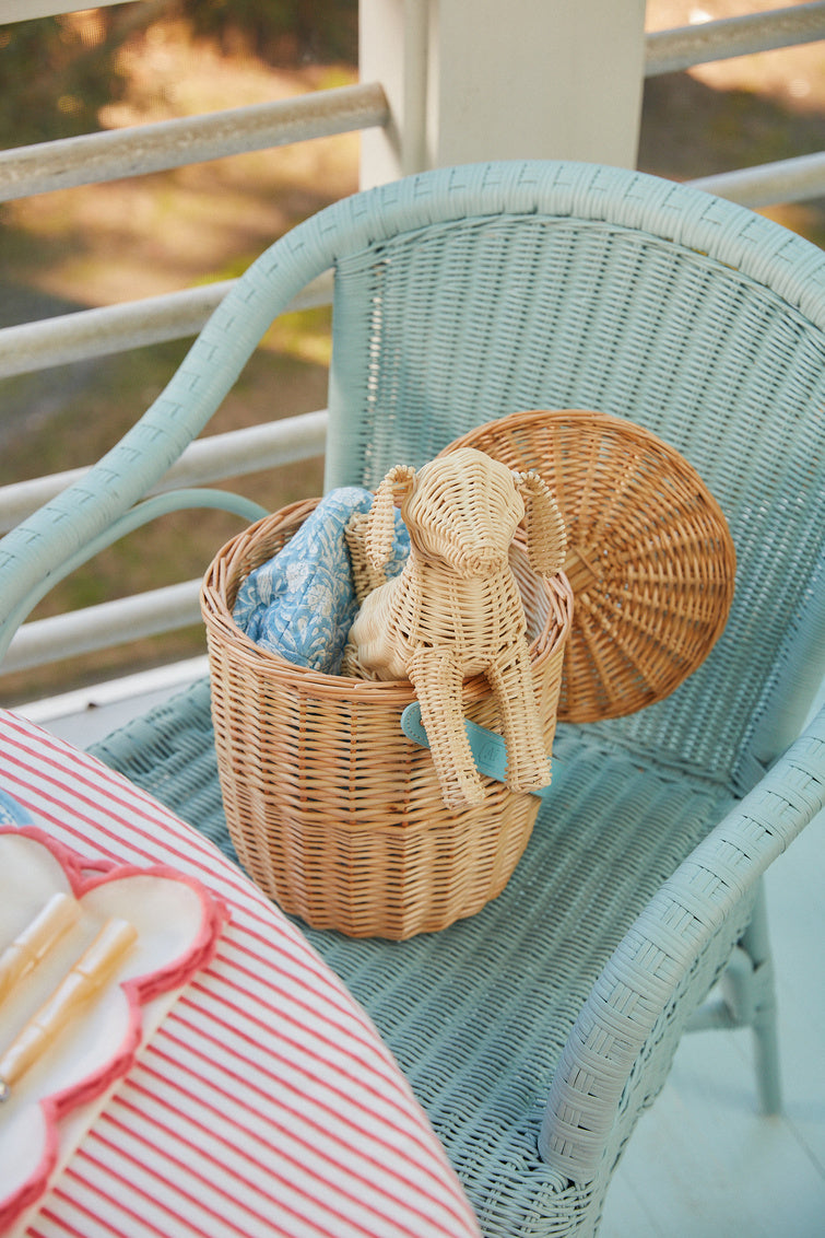 Little Potcake by Amanda Lindroth is a natural rattan weave dog figure. Whimsical lifestyle display
