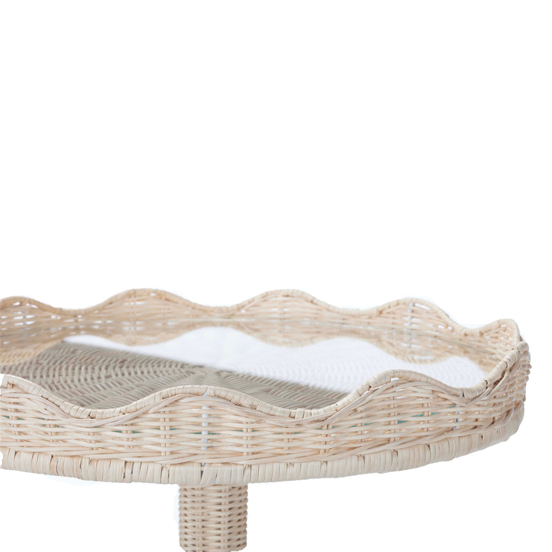 Sloane Side Table by Amanda Lindroth has a glass insert, rattan table