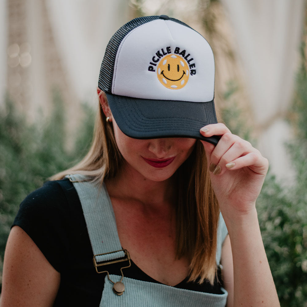 Pickle Baller Foam Trucker Hat with smiling happy face emoji in black and white