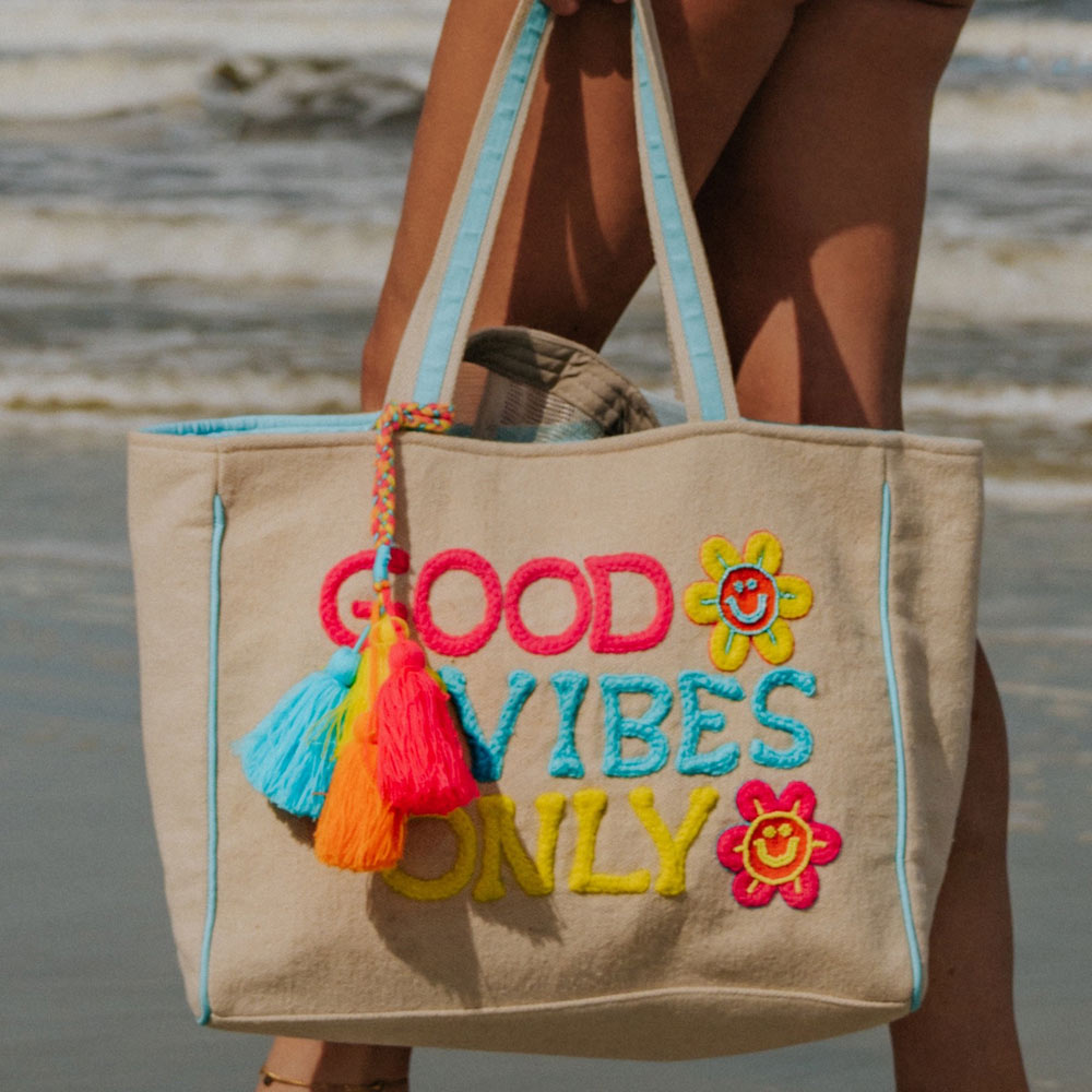 Good Vibes Only Tote Bag with colorful message and shoulder strap with tassel