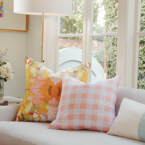 Gingham Coral Decorative Throw Pillow in living area sofa display