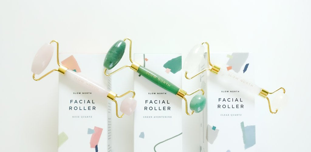 Facial rollers in aventurine, rose quartz, and clear quartz beauty ritual spa tool