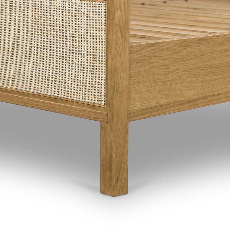 Allegra Bed oak frame with light cane detailing from Four Hands base corner detail