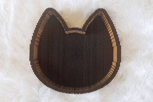 Cat Scratcher Bed has raised edges for scratching and leaning against during nap