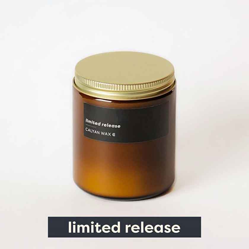 Limited Release Fig + Grapefruit scented candle in amber jar stacked with open jar Calyan Wax Co. Harley Butler Trading Company