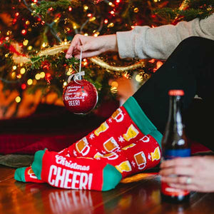 Christmas Beer Socks and Ornament woman hanging ornament