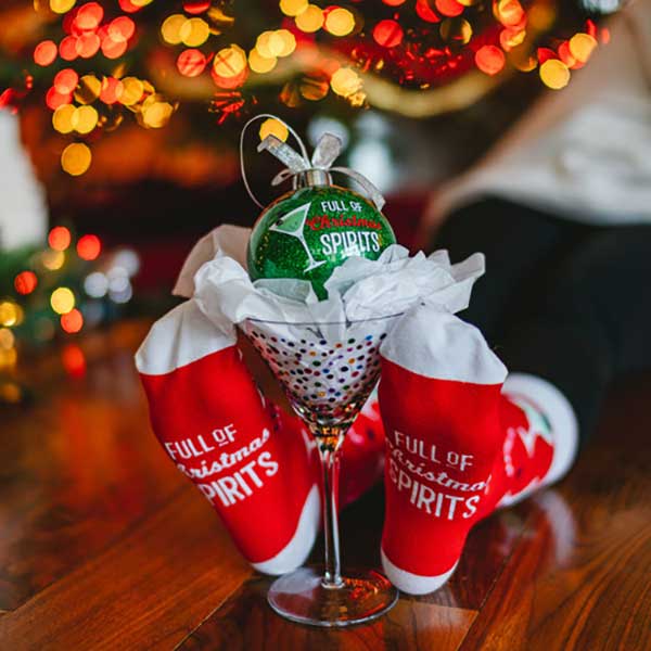 Christmas Spirits socks and ornament gift set red socks with martini glasses lifestyle image