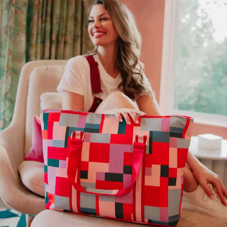 Color Block Tote Travel Bag has a colorful geometric pattern, handy carry handles.
