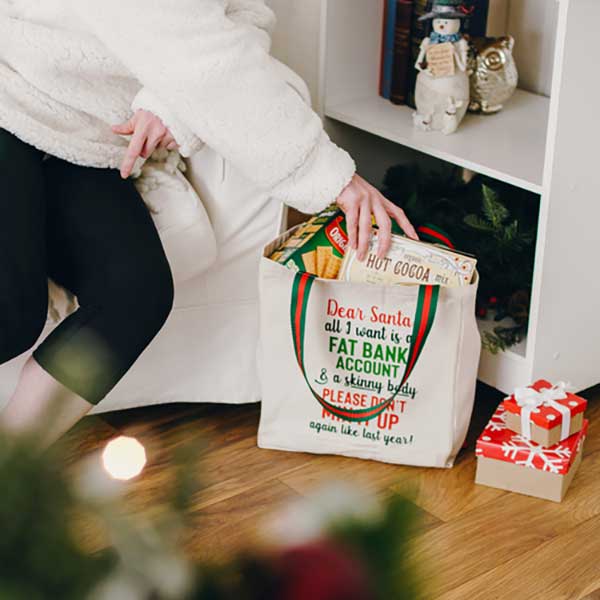 Dear Santa twill gift bag with fun saying in Christmas colors lifestyle view