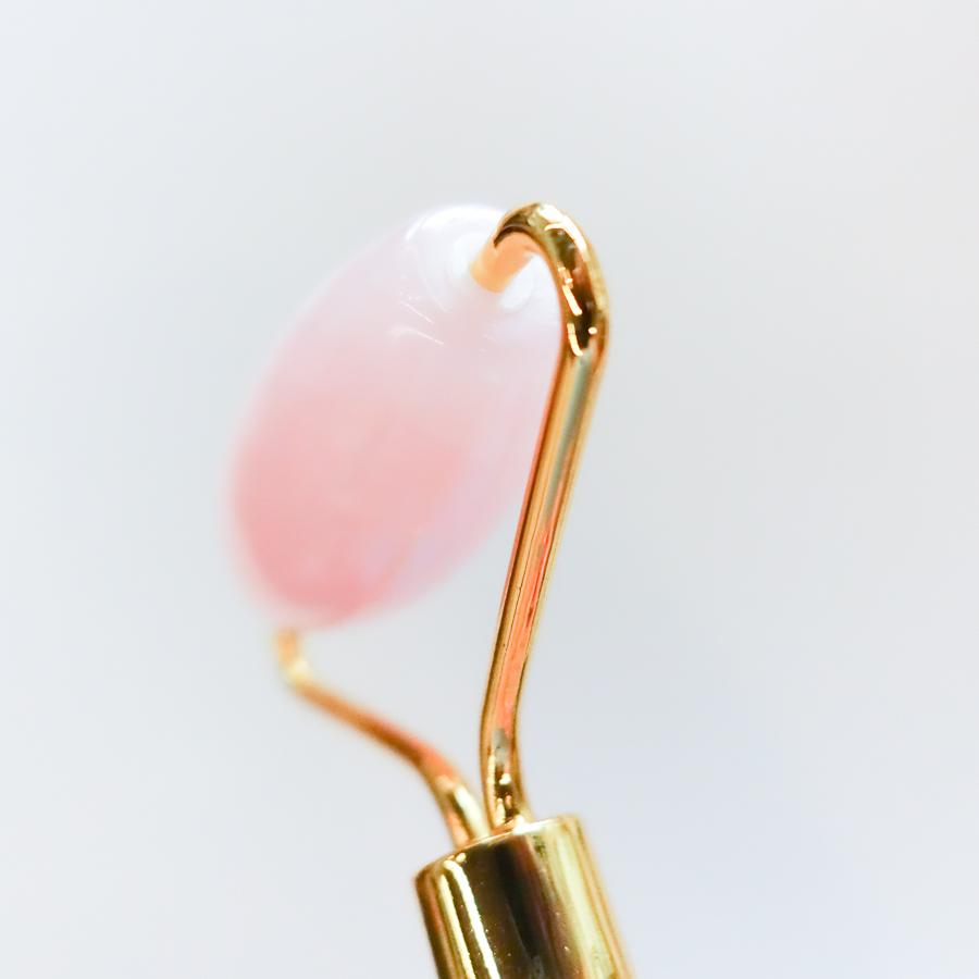 Facial roller rose quartz beauty ritual spa tool close up