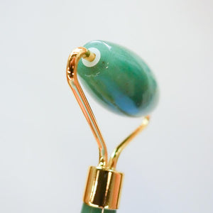 Facial roller rose quartz beauty ritual spa tool close-up