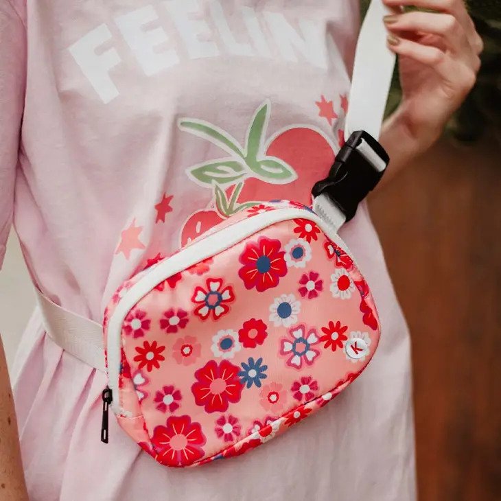 Flower Power Belt Bag in peaches and reds. Wear it as a fanny pack or crossbody bag with the adjustable strap.