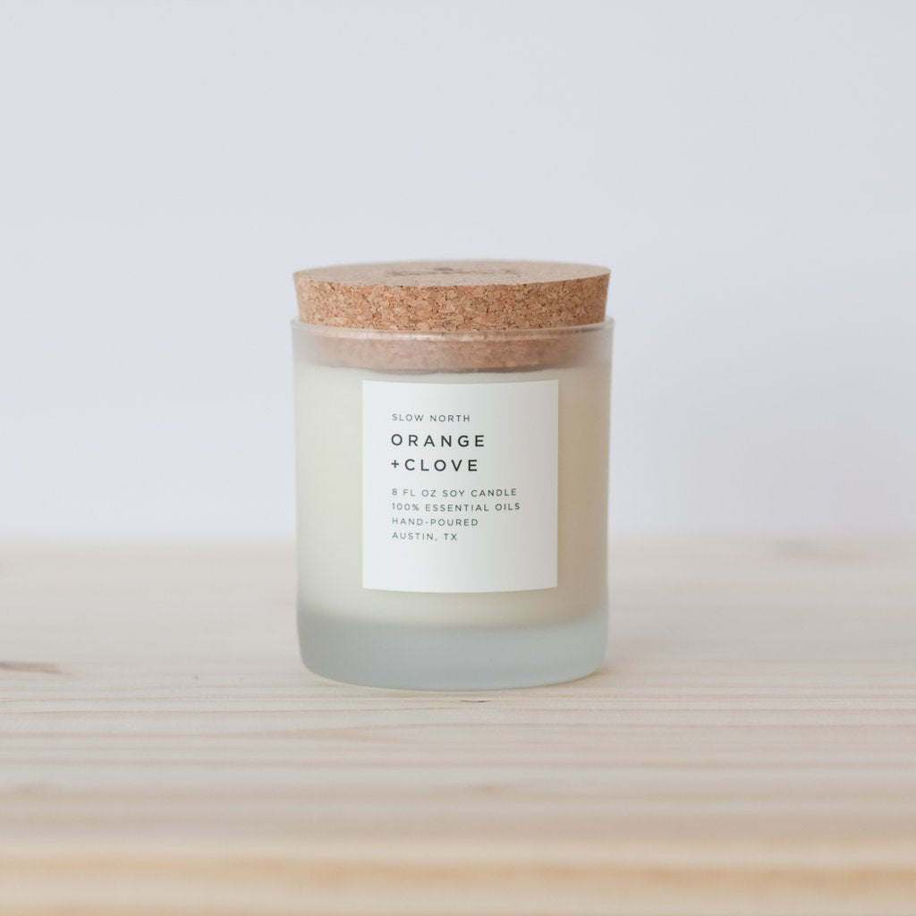 Slow North 100% Orange and Clove essential oil wax candle in frosted glass