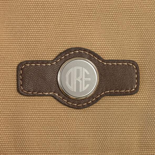 Hanging toiletry bag in light brown canvas with leather accents, monogram detail