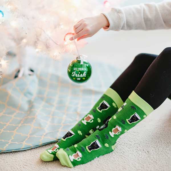Get Your Irish On Christmas socks and ornament woman hanging ornament wearing socks