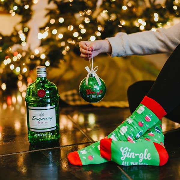 Gin-Gle Holiday Socks and ornament gift set green socks and ornament girl holding ornament